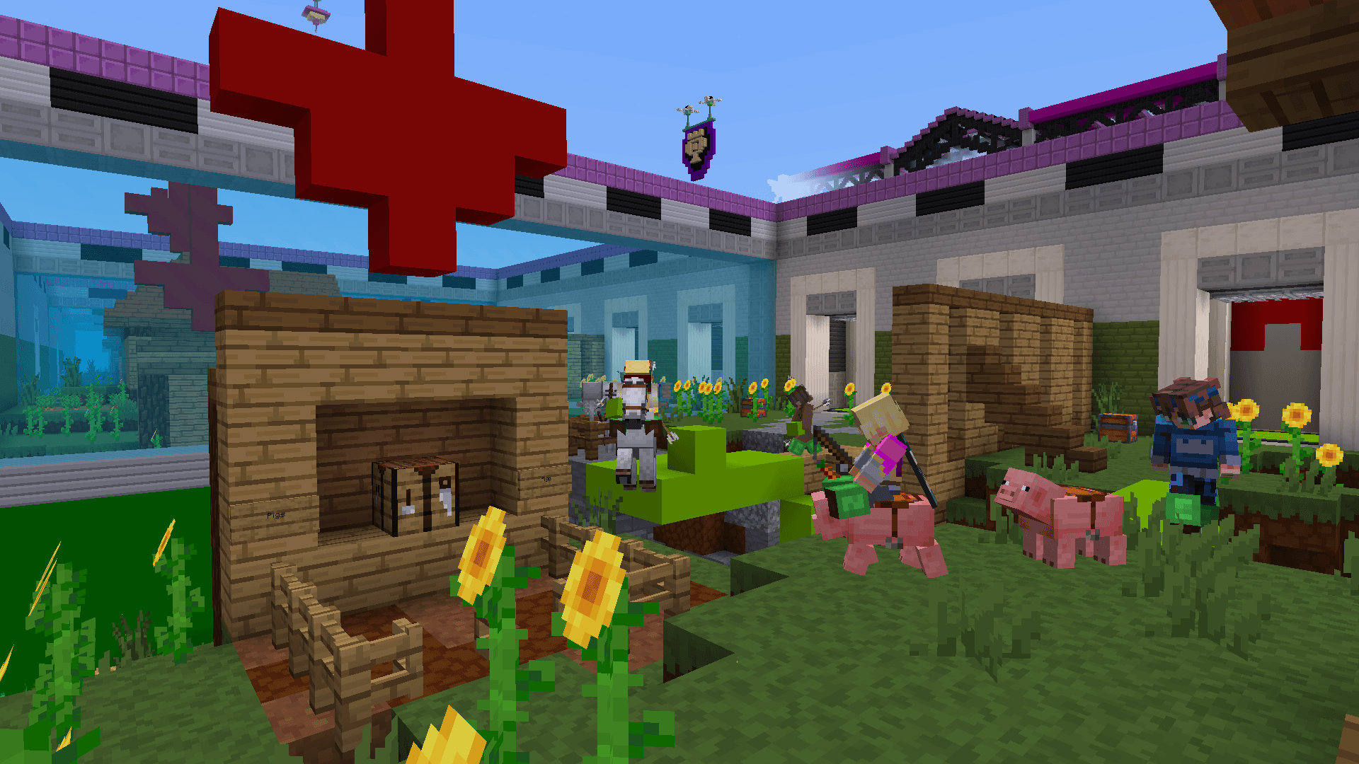 One player rides a pig, and another holds a sword in a room near a wooden structure with a crafting table in, with a red arrow pointing to it, with sunflowers around them.