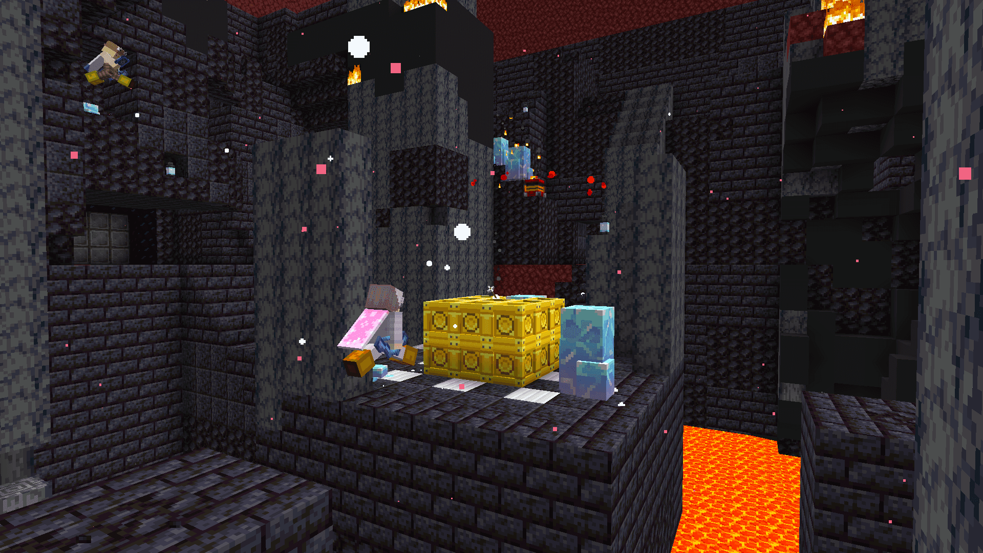 Players in a nether fortress-like structure. A player with elytra hovers near a stack of blocks, including gold and diamond blocks. Surrounding the structure are lava pools and dark stone walls.